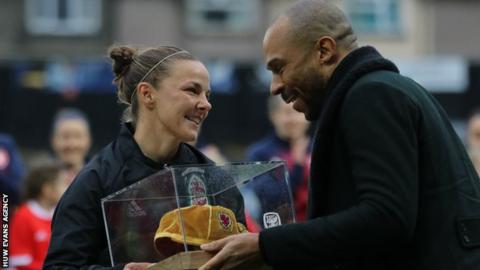 Loren Dykes receives a special 100th cap from Danny Gabbidon