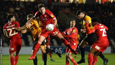 Padraig Amond heads an effort on goal