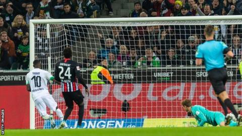 Marcus Thuram scoring Borussia Moenchengladbach's first goal against Eintracht Frankfurt.
