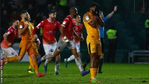 Newport County's Tristan Abrahams shows his despair after having his penalty saved
