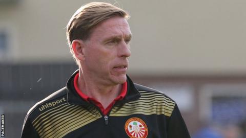 Portadown assistant boss Vinny Arkins watches the team being pummelled by Dungannon