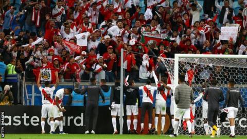 Peru celebrate with their fans at the final whistle