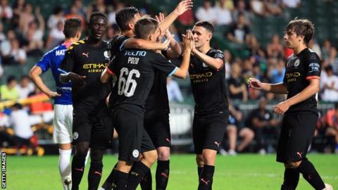 Phil Foden and Man City team-mates