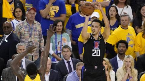 Los Angeles Clippers guard Landry Shamet rises up to hit the sport-a success three-pointer against the Golden Order Warriors