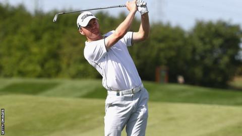 Michael Hoey watches his second shot at the 18th in Prague