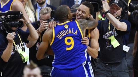 Golden State's Stephen Curry and Andre Iguodala celebrate