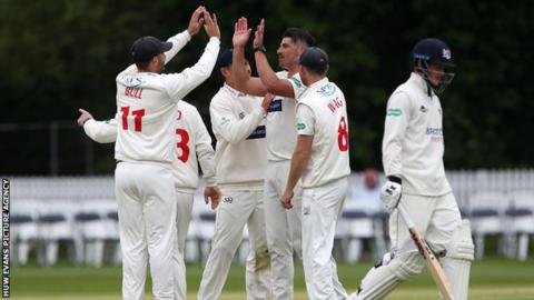 Glamorgan celebrate the wicket of Miles Hammond