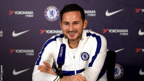 Chelsea manager Frank Lampard smiling at a press conference