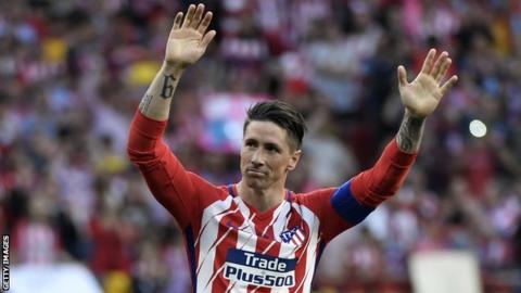 Atletico Madrid striker Fernando Torres waves to the crowd