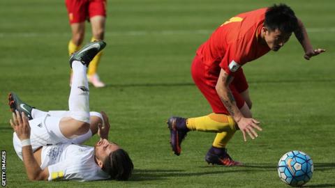 Jiang Zhipeng (right) in action against Iran