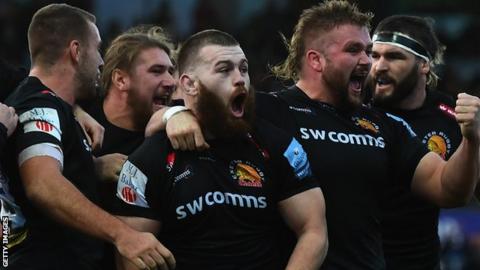 Exeter celebrate their opening try against Saracens