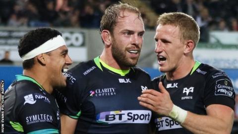Alun Wyn Jones is congratulates by Ospreys team-mates Josh Matavesi and Ben John