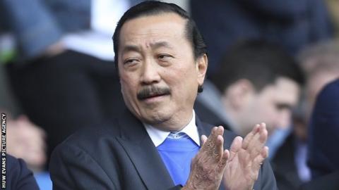 Cardiff City owner Vincent Tan applauds as he watches his side