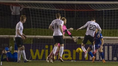 Liam Henderson scores