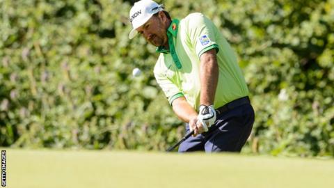 Graeme McDowell plays his second shot to the 16th at Glen Abbey on Thursday