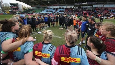 Harlequins huddle after their victory