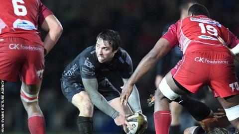 Rhodri Williams prepares to make a pass for Dragons against Scarlets