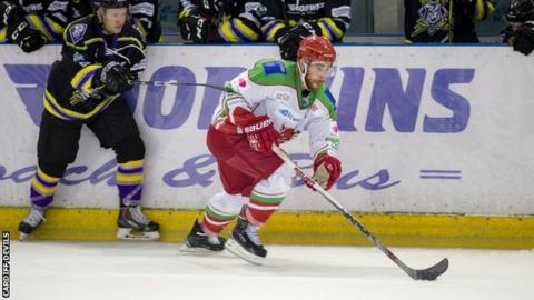 Cardiff Devils' Zach Hervato skates away from a Manchester defender