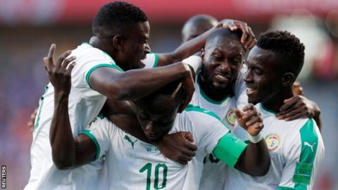 Senegal's players celebrate a goal at the 2018 World Cup