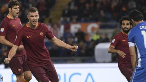 Edin Dzeko celebrates scoring for Roma against Empoli