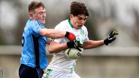David Gouldson and Conall Devlin contend for possession at Inniskeen