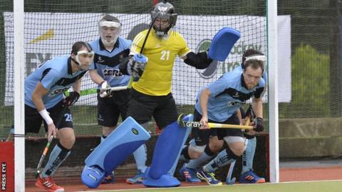 Lisnagarvey defend against UCD at Comber Road