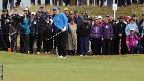 Gavin Moynihan plays an approach during the morning foursomes