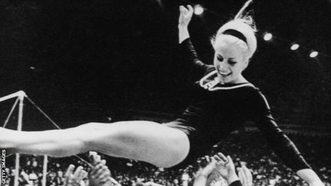 Vera Caslavska being lifted in the air