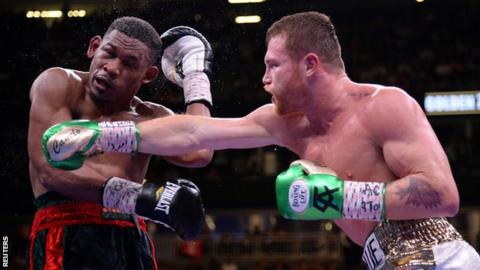 Saul 'Canelo' Alvarez lands a punch on Daniel Jacobs