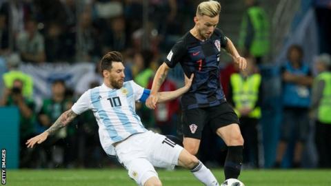 Ivan Rakitic tackles Barcelona club mate Lionel Messi as Croatia beat Argentina in the World Cup