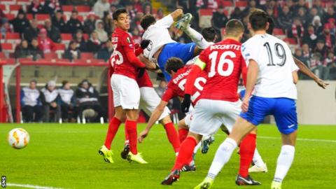 Roman Eremenko, centre, heads in early on
