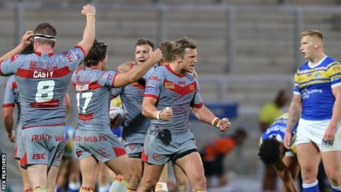 Catalans Dragons celebrate a try against Leeds Rhinos