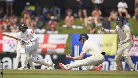 England's Keaton Jennings stays low to take a left-handed catch and dimiss Sri Lanka batsman Dhananjaya de Silva during the second Test