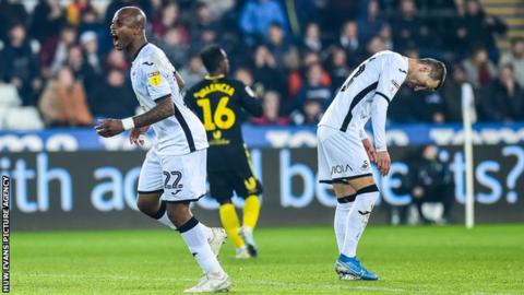 Swansea striker Andre Ayew shows his frustration during their heavy home loss to Brentford