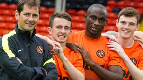 Jackie McNamara, left, took Andy Robertson, right, to Tannadice