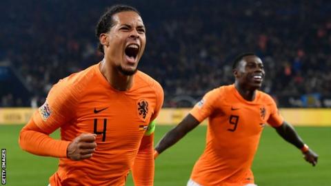 Virgil van Dijk celebrates scoring for the Netherlands against Germany