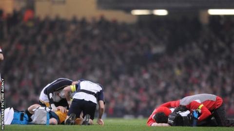 Stirling Mortlock and Jamie Roberts are attended to after their 2008 collision