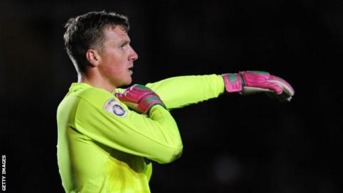 Dagenham goalkeeper Elliot Justham