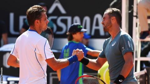 Stan Wawrinka (left) and Steve Johnson shaking hands at the net