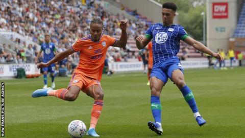 Bobby Reid of Cardiff and Antonee Robinson of Wigan Athletic