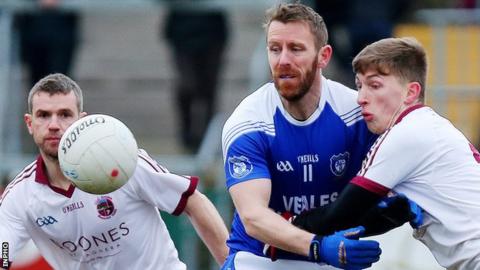 Cavan Gaels captain Michael Lyng is challenged by Slaughtneil's Paul McNeill in the Armagh decider