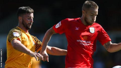 Padraig Amond of Newport County challenges Olly Lancashire of Crewe Alexandra