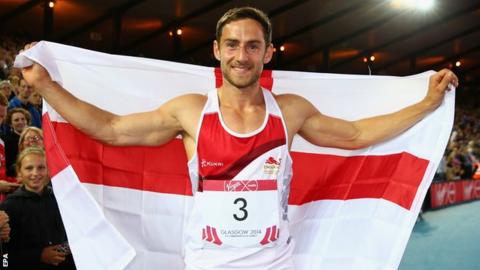 Ashley Bryant celebrates with the England flag