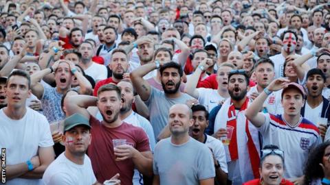 England fans watch their team play Colombia in London