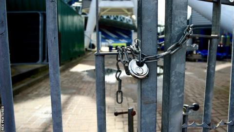 Locked gates at football stadium