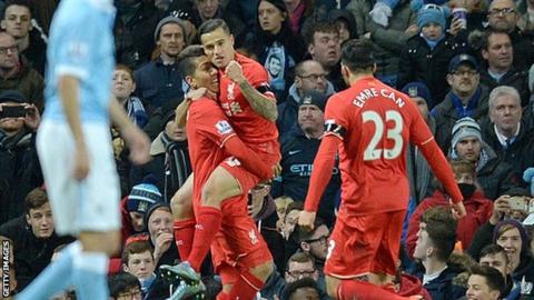 Liverpool's Philippe Coutinho celebrates scoring against Manchester City with team-mates Roberto Firmino and Emre Can