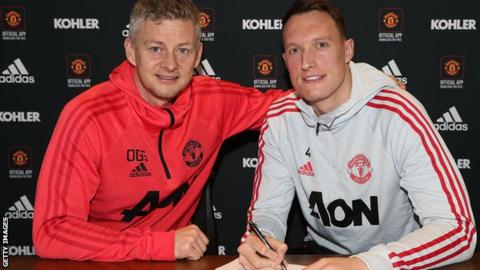Manchester United interim manager Ole Gunnar Solskjaer and defender Phil Jones