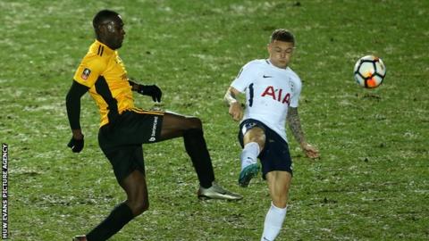 Frank Nouble and Kieran Trippier challenge for the ball during Spurs' trip to Rodney Parade.