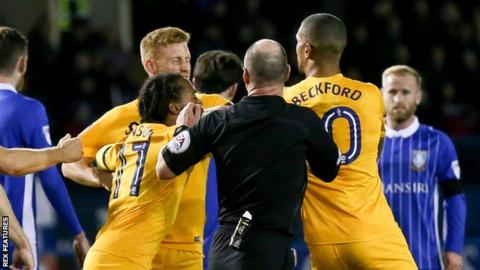 Eoin Doyle and Jermaine Beckford come to blows