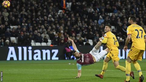 Andy Carroll, who had an excellent all-round game, scores with a stunning mid-air volley